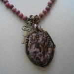 Judy Ellis's Gem Profile- Rhodonite - , General Education, , Rhodonite cabochon pendant