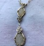 Dale Armstrong's Gem Profile- Moonstone - , General Education, , Carved Moonstone Faces wrapped in sterling silver wire 