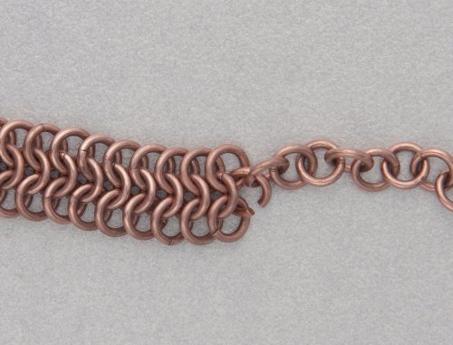 Kylie Jones's Copper Braided Chain Maille Bracelet - , Chain Maille Jewelry, Making Chain, Chain Making , Oxidizing Wire, Oxidizing, Antiquing Wire, Antiquing, place the end copper ring from one of the longer 1-in-1 chains inside the ring