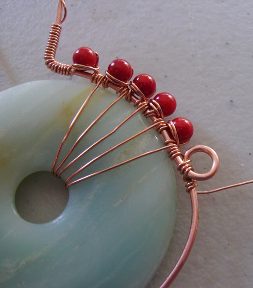 Mary Bailey's Spirit Pendant - , Contemporary Wire Jewelry, Coiling, Coiling Wire, Wire Coiling, Weaving, Wire Weaving, Weaving Wire, 26-gauge wire being looped around the piece more.