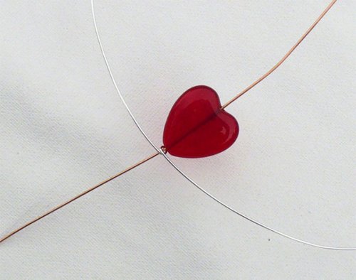 Marty Blu's My Valentine Heart Pendant - , Contemporary Wire Jewelry, Wire Wrapping, Wrapping, Wire Wrapping Jewelry, Heart shaped bead being added to round wire.