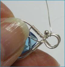 Judy Larson's Beaded Briolette Pendant - , Wire Weaving, Wire Wrapping, Wrapping, Wire Wrapping Jewelry, Weaving, Wire Weaving, Weaving Wire, Adding bead to the wire being wrapped around frame.