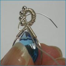 Judy Larson's Beaded Briolette Pendant - , Wire Weaving, Wire Wrapping, Wrapping, Wire Wrapping Jewelry, Weaving, Wire Weaving, Weaving Wire, Continue wrapping around the loops.