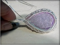 Cynthia Wyatt's Infinity Pendant - , Contemporary Wire Jewelry, Coiling, Coiling Wire, Wire Coiling, Lashing, Wire Lashing, Wire Wrapping, Wrapping, Wire Wrapping Jewelry, Crimping the 22 gauge half round wire so it lays against the stone.