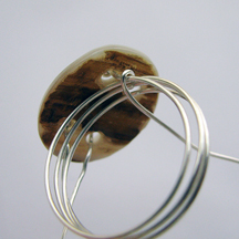 Albina Manning's Button Ring - , Contemporary Wire Jewelry, Wire Wrapping, Wrapping, Wire Wrapping Jewelry, Removing ring from mandrel.