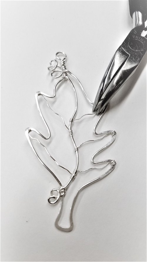 Kimberly Newman's Silver Lined Leaf Pendant - , Contemporary Wire Jewelry, Lashing, Wire Lashing, Loops, Wire Loop, Wrapped Wire Loop, Spirals, Wire Spiral, Spiral Wire Wrap, give the wires a slight twist with the pliers