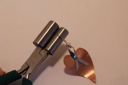 Judy Freyer Thompson's Ribbon Heart Earrings - , Contemporary Wire Jewelry, Forging, Forging Jewelry, Jewelry Forging, How To Punch Holes, Hole Punching, Punch A Hole, Riveting, Riveting Techniques, Wire Rivets, Drilling, Drill, make the ear wires